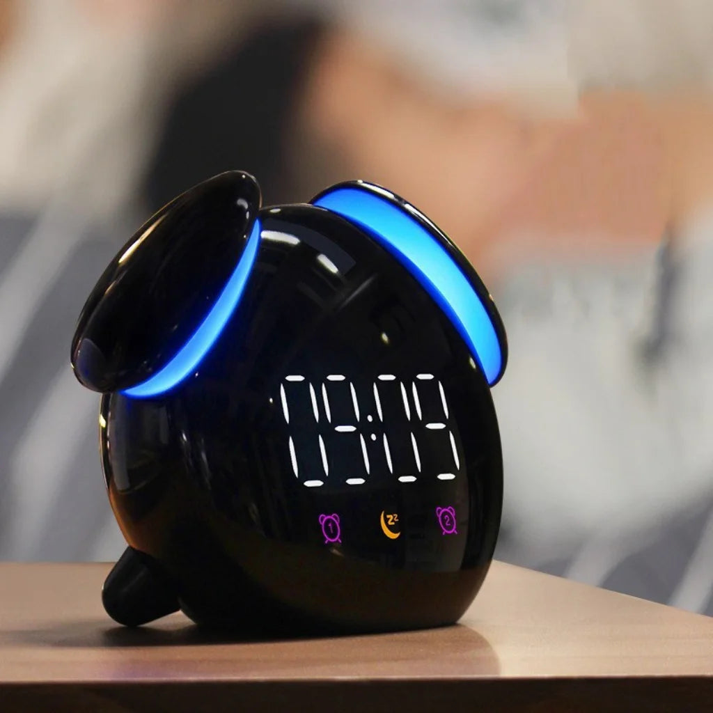 Black digital clock with blue LED lights on a wooden surface